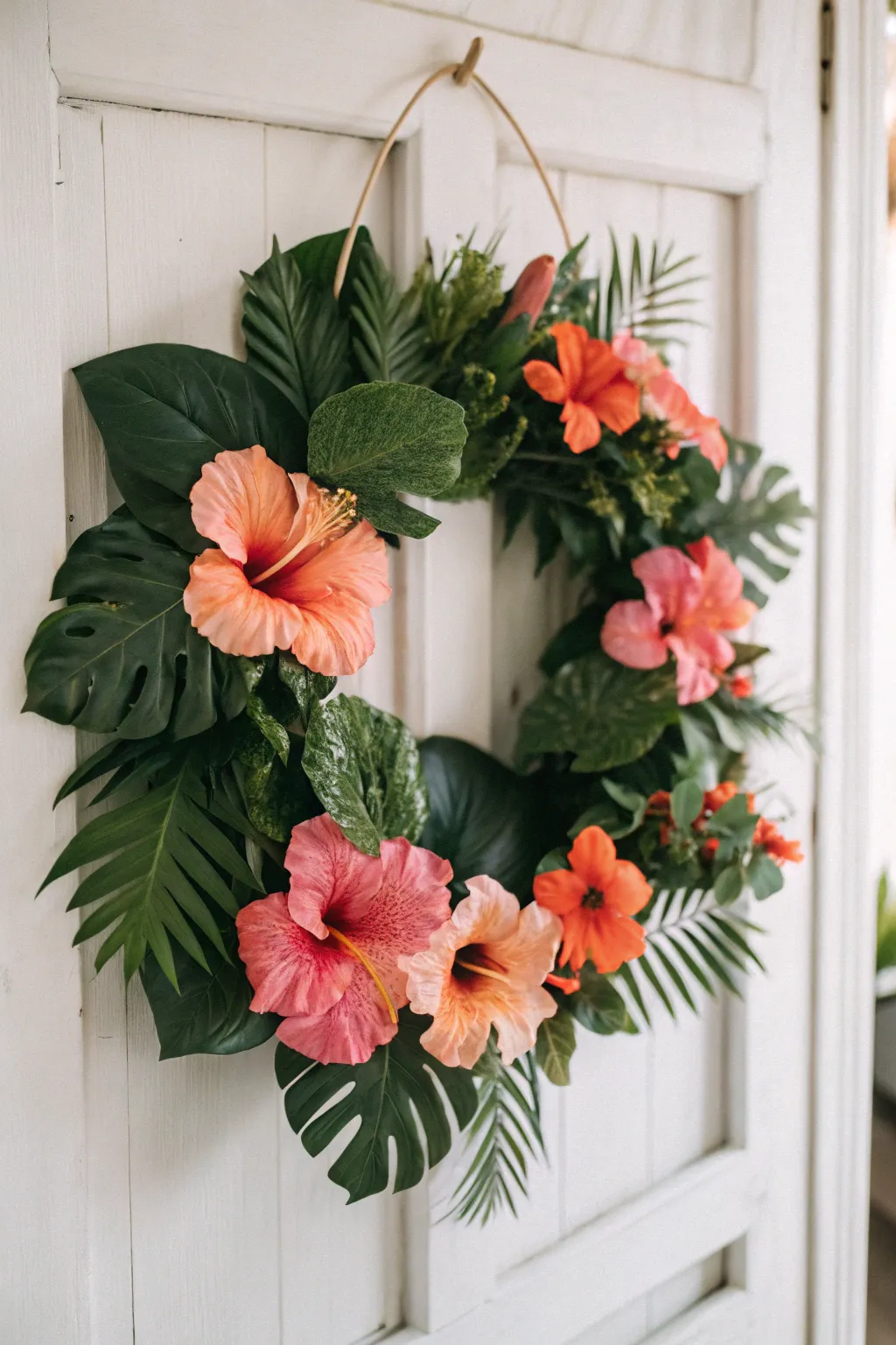 Bring the tropics home with a stunning hibiscus and monstera wreath.