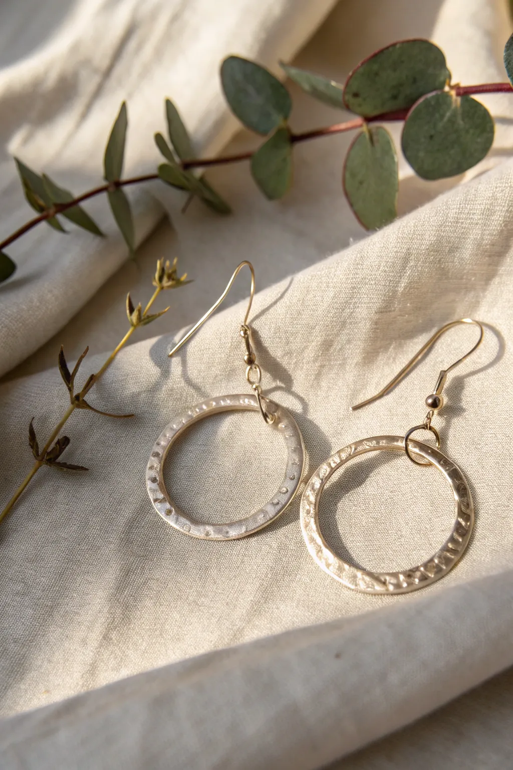 Embrace minimalist elegance with these handcrafted hammered metal earrings, where simplicity meets natural beauty.