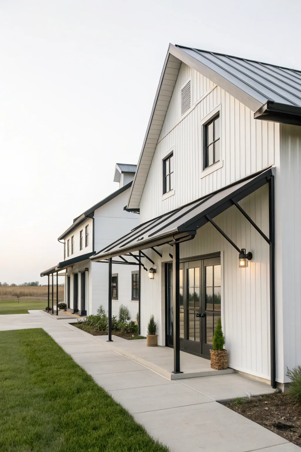 Minimalist metal awnings provide a sleek, modern look to this farmhouse.