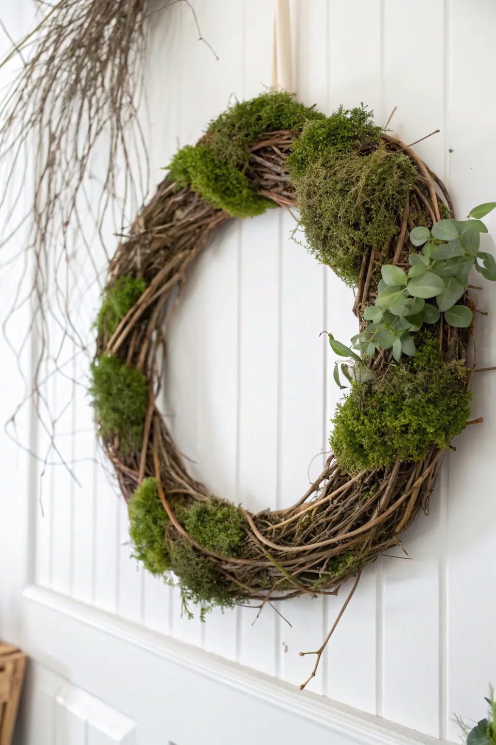 Elevate your space with a rustic yet elegant grapevine and moss wreath.