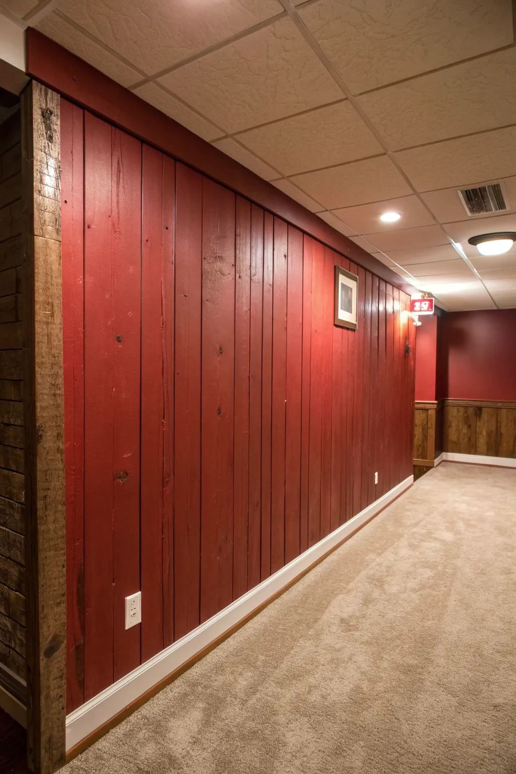 Transform your space with the warm embrace of rustic red, perfect for a cozy, farmhouse-inspired basement.