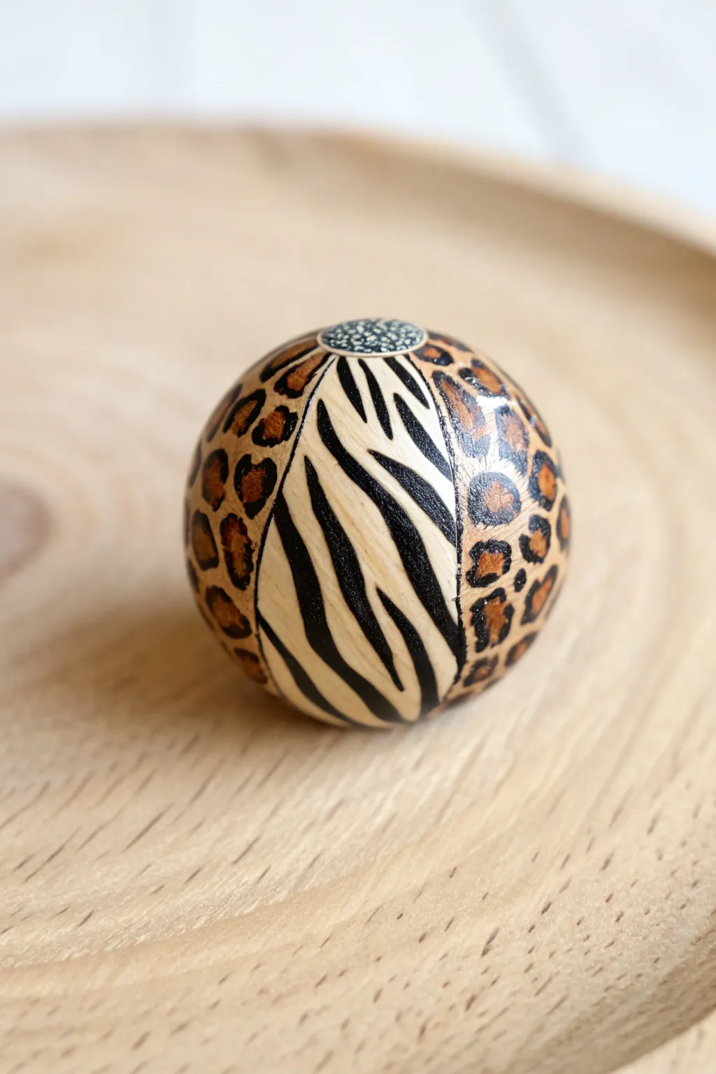 Unleash your wild side with this beautifully crafted animal print polymer clay bead, perfect for adding a fierce touch to any outfit.