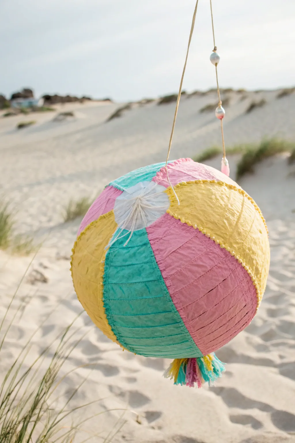 Dive into summer fun with this charming beach ball pinata, perfect for a splashy poolside celebration!