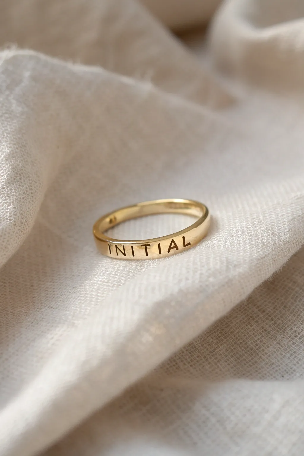 Wear your story with elegance: a single initial ring, perfect for stacking.