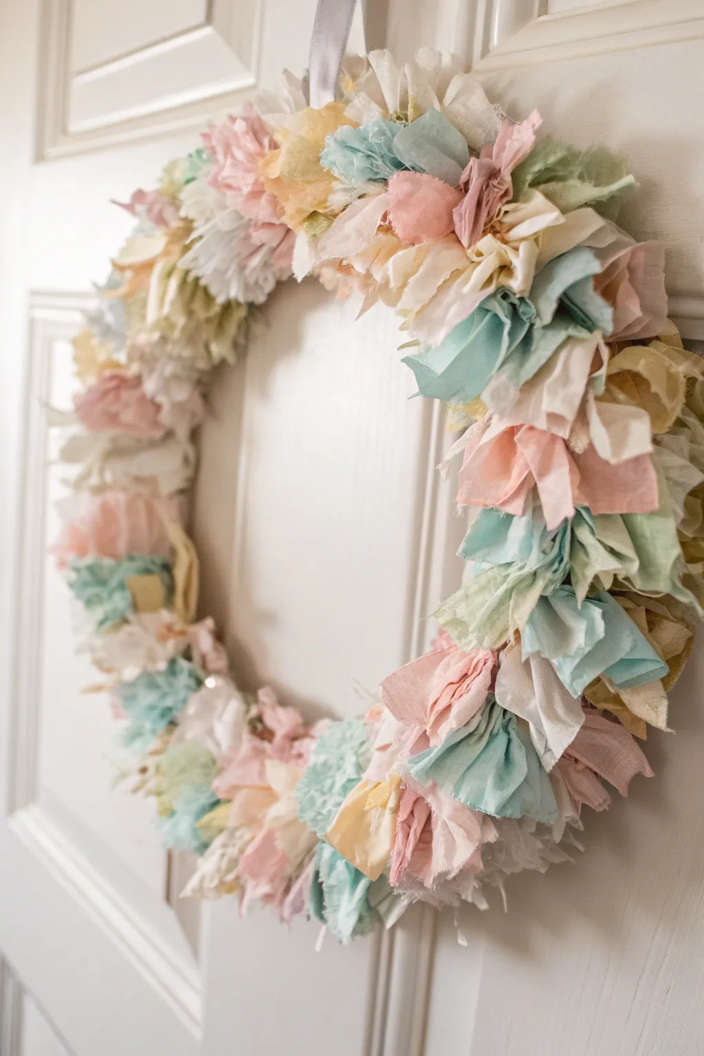 Transform your fabric leftovers into a stunning summer wreath that brings boho charm and eco-friendly beauty to your home.