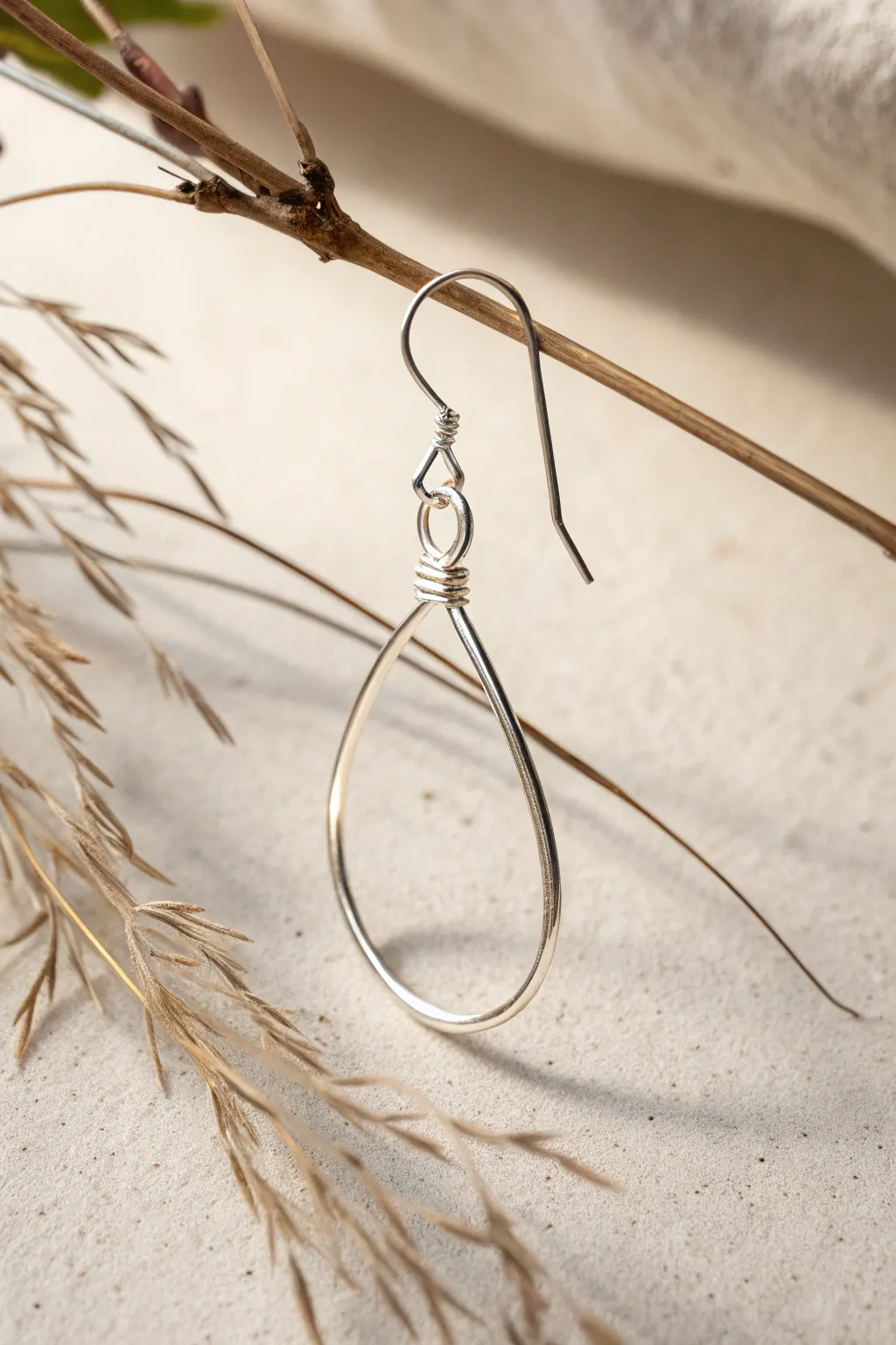 Embrace minimalist elegance with a single wire loop earring that complements any style effortlessly.