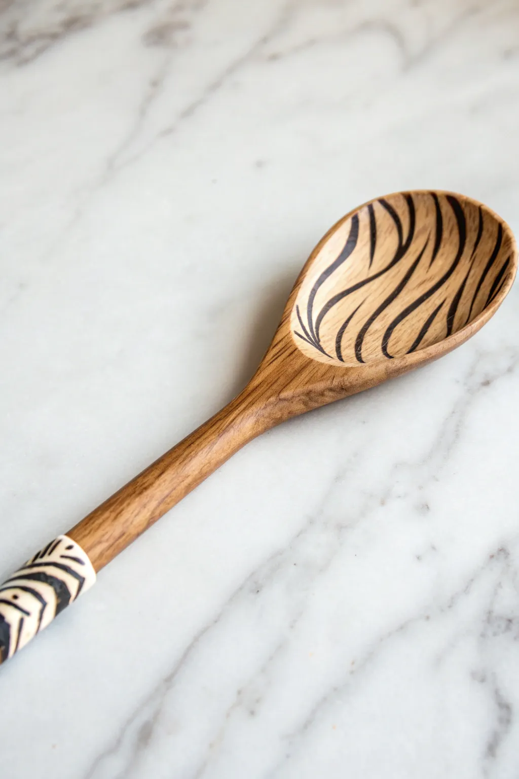 Add a touch of the wild to your kitchen with beautifully painted animal print wooden spoons. 🦓✨ #ScandiBoho #Craftsmanship